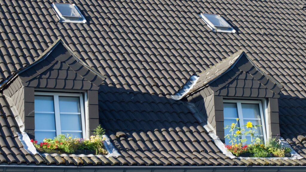 rooflights set into a tiled slope and flashed at the kerb